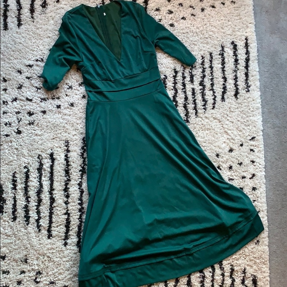 Emerald green tea length dress.